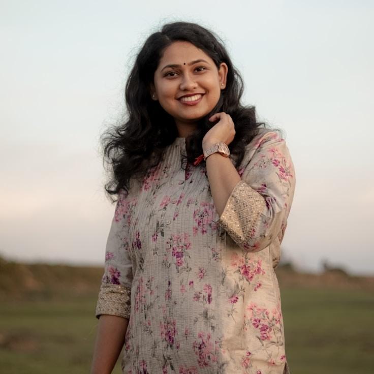 Alex Carter, Lead Design Curator at Prismonex Data Grid, reviewing corporate floral arrangements